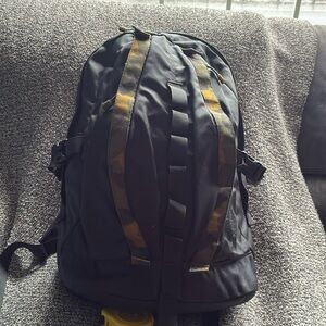 The North Face Black and Gold Backpack